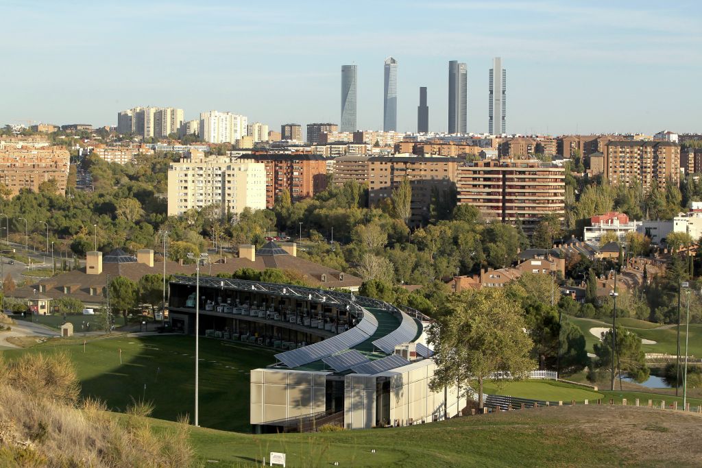 Centro Nacional de Golf in Madrid, with the city and the Cuatro Torres skyline directly behind the course