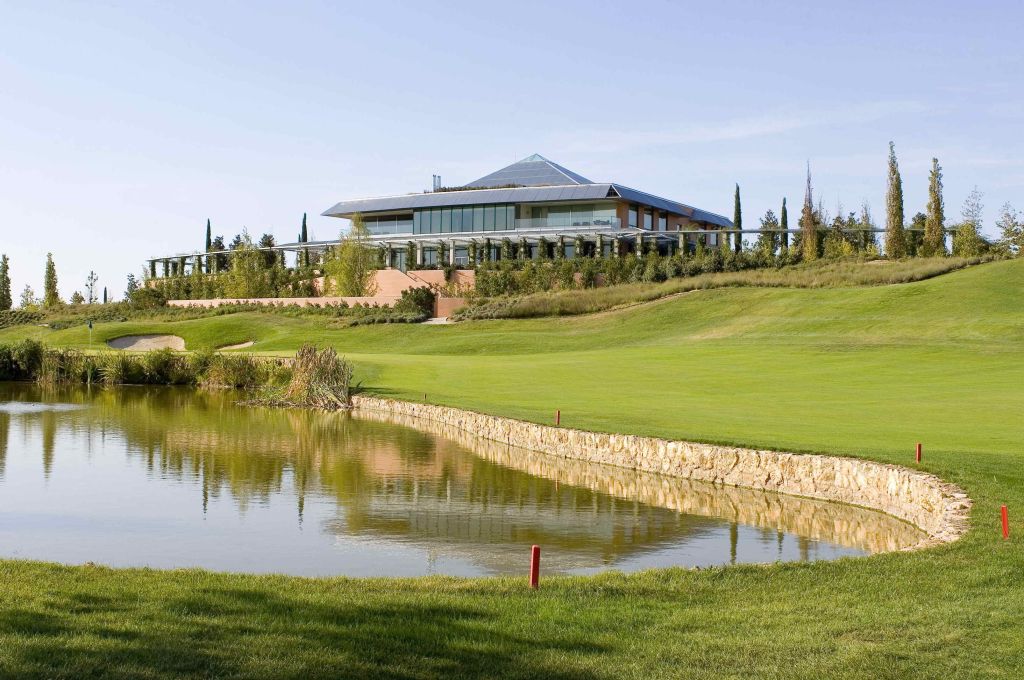 The clubhouse and lakeside green at Golf Santander in Boadilla del Monte, near Madrid