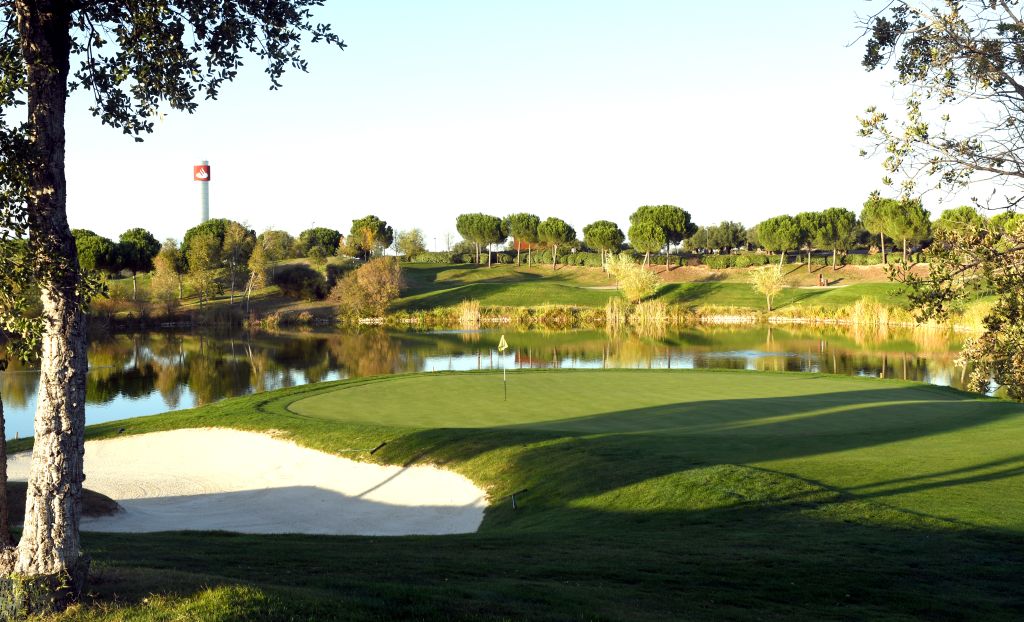 Golf Santander championship green by the water, one of the private-feeling golf courses in Madrid open to visitors
