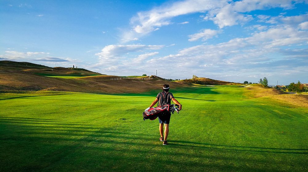 Golfer walking down the fairway at Centro Nacional de Golf, Madrid